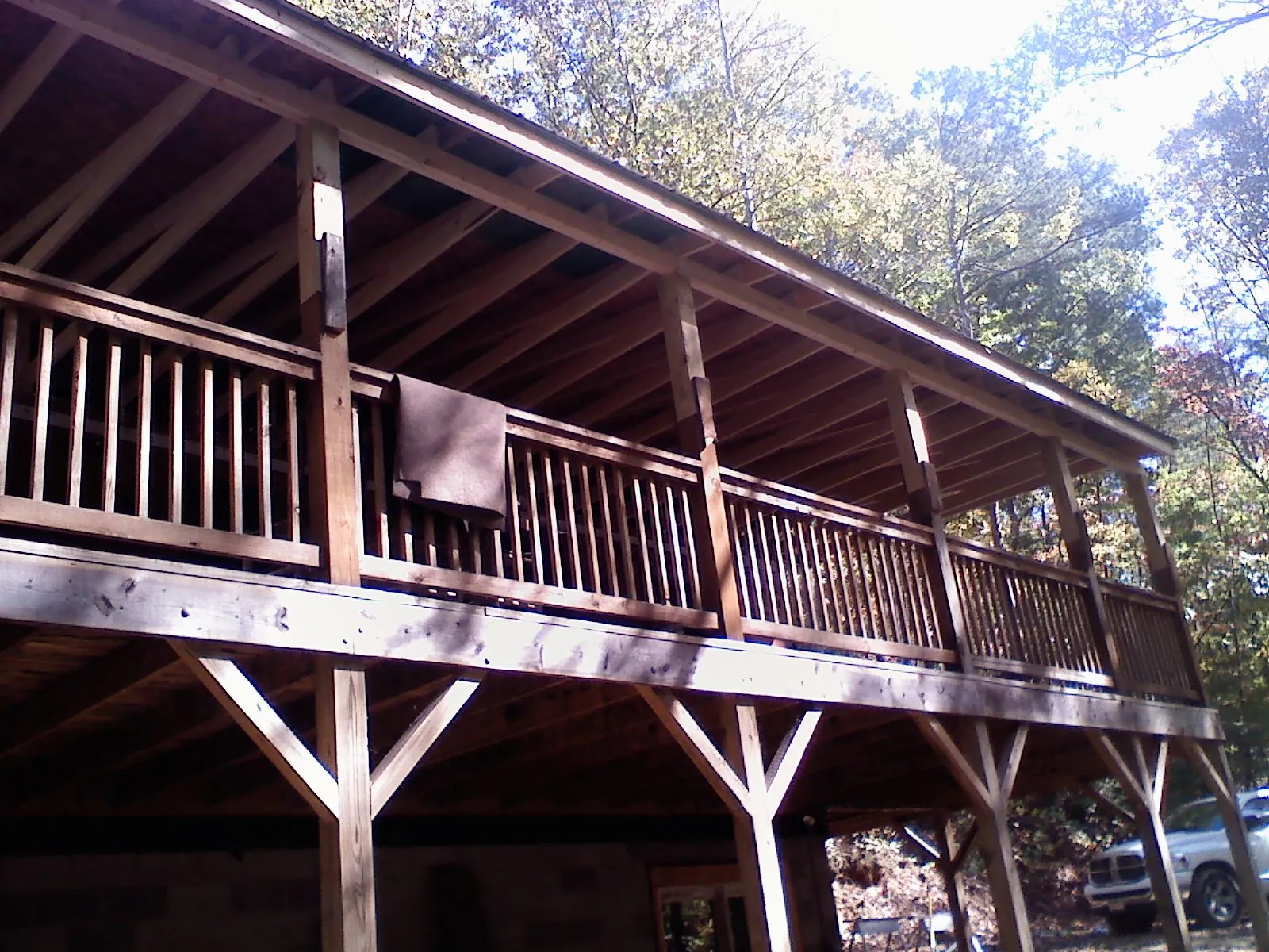 Timber framing under a new elevated porch and deck in Fletcher